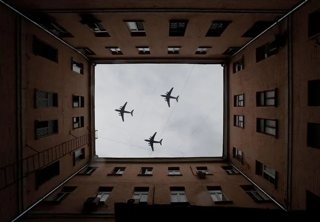 Russian Il-76 military transport aircrafts fly in formation during a rehearsal for the flypast, which marks the 75th anniversary of the victory over Nazi Germany in World War Two, in Moscow, Russia on May 4, 2020. The traditional large-scale Victory Day military parade across Red Square was postponed due to the outbreak of the coronavirus disease (COVID 19). (Photo by Maxim Shemetov/Reuters)