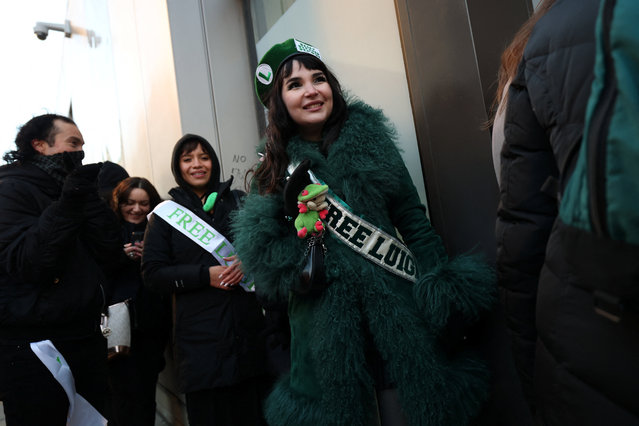 Supporters of Luigi Mangione, the suspect in the killing of UnitedHealthcare chief executive Brian Thompson, gather outside Manhattan Criminal Court, ahead of his appearance for a pre-trial hearing on murder charges, in New York City, New York, U.S., December 1, 2025. (Photo by Mike Segar/Reuters)