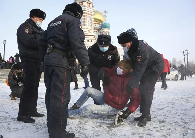 Police detain a man during a protest against the jailing of opposition leader Alexei Navalny in Siberian city of Omsk, Russia, Saturday, January 23, 2021. (Photo by AP Photo/Stringer)