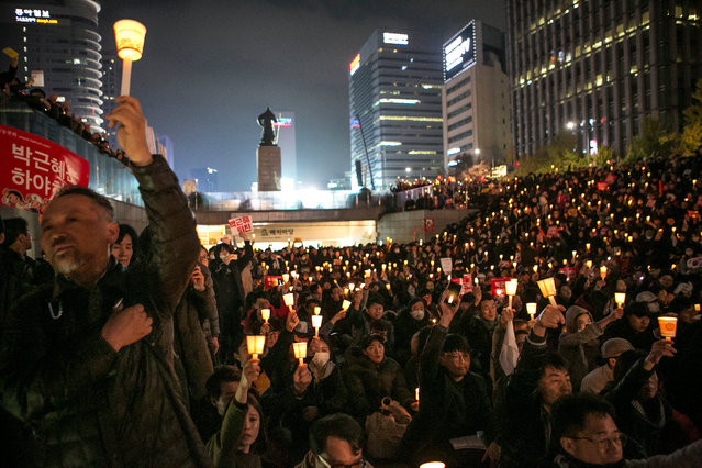 Thousands of South Koreans take to the streets in the city centre to participate in a candlelight rally to demand President Park Geun-Hye to step down on November 12, 2016 in Seoul, South Korea. (Photo by Jean Chung/Getty Images)