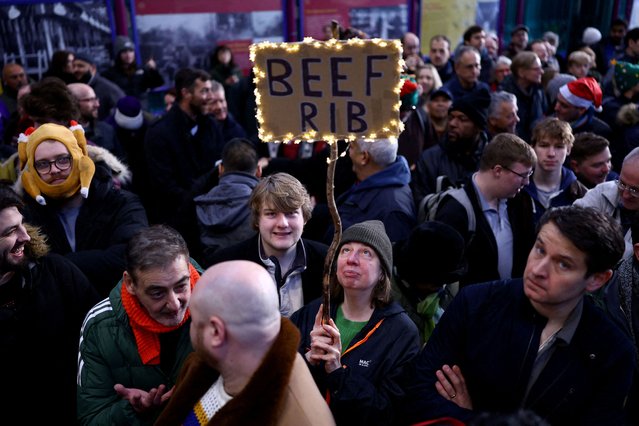 Shoppers attend a pre-Christmas meat auction held by G Lawrence butchers at Smithfield Market in London, Britain, on December 24, 2024. (Photo by Hannah McKay/Reuters)