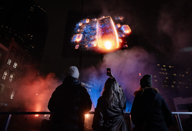 Visuals of a blue whale, Northern lights, and football tricks measuring 65-foot by 50-foot are displayed in a hologram show over London's Shoreditch on January 16, 2025 to preview the forthcoming Samsung's Galaxy Unpacked launch. (Photo by Matt Alexander/PA Media Assignments)