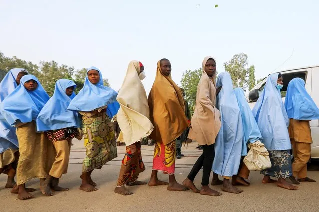 Girls who were kidnapped from a boarding school in the northwest Nigerian state of Zamfara walk in line after their release, in Zamfara, Nigeria on March 2, 2021. (Photo by Afolabi Sotunde/Reuters)