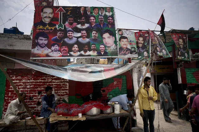 In this July 19, 2018, photo, Banners and posters of election candidates from political parties, decorated outside a compound of Christian neighborhood in Islamabad, Pakistan. Minorities face a daunting battle in parliamentary elections this week in Muslim-majority Pakistan, striving for more representation and a voice that will speak up for them in an increasingly intolerant and radical atmosphere. (Photo by B.K. Bangash/AP Photo)