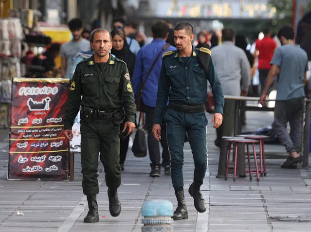 Iran's police forces walk on a street during the revival of morality police in Tehran, Iran on July 16, 2023. (Photo by Majid Asgaripour/WANA (West Asia News Agency) via Reuters)