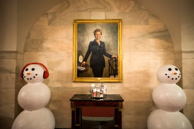 A portrait of Hillary Clinton from her time as First Lady hangs next to holiday decor at the White House in Washington, DC, USA, 29 November 2016. The majority of the holiday decor was designed by Rafanelli Events and executed by 92 volunteers from across the country. (Photo by  Jim Lo Scalzo/EPA)
