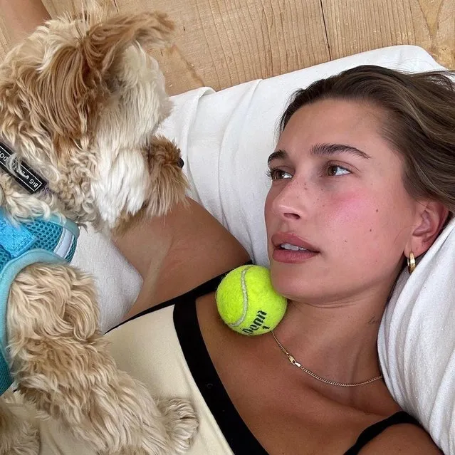 American model Hailey Bieber early August 2023 shares a cute snap of her playing with her dog. (Photo by Instagram)