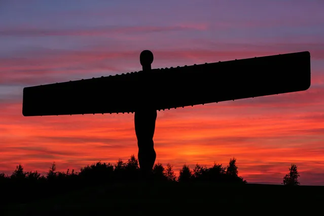 Gateshead experiences a stunning sunset in the skies above the instantly recognizable silhouette of the Angel of the North sculpture designed by Sir Antony Gormley. Gateshead, United Kingdom on Monday August 15, 2016. (Photo by i-Images/PacificCoastNews)