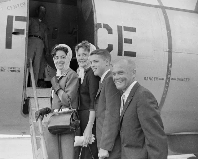 Astronaut John H. Glenn (right) with his family (l to r), wife, Annie, son and daughter, Lyn and David, board and Air Force plane in the Key West, Fla., on February 26, 1962, Boca Chica naval air base for the flight to Palm Beach where they will join President John Kennedy.   From there they will fly to Washington, D.C., and a hero's welcome and parade. (Photo by AP Photo)