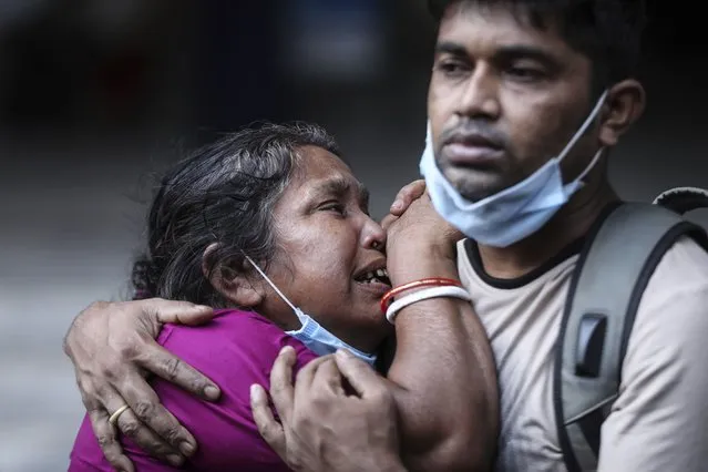 A Bangladeshi woman mourns the death of her husband who died of COVID-19 at a hospital in Dhaka, Bangladesh, Friday, May 7, 2021. India's surge in coronavirus cases is having a dangerous effect on neighboring Bangladesh. Health experts warn of imminent vaccine shortages just as the country should be stepping up its vaccination drive, and as more contagious virus variants are beginning to be detected. (Photo by Mahmud Hossain Opu/AP Photo)