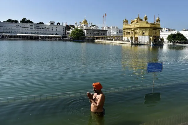 A Sikh devotee prays at the Golden Temple, Sikhism's holiest shrine, in Amritsar, India, September 20, 2023, 2023. India has advised its citizens to be careful when traveling to Canada as a rift between the two nations escalates further in the wake of Ottawa’s allegations that India may have been involved in the killing of a Sikh separatist leader in suburban Vancouver. (Photo by Prabhjot Gill/AP Photo)