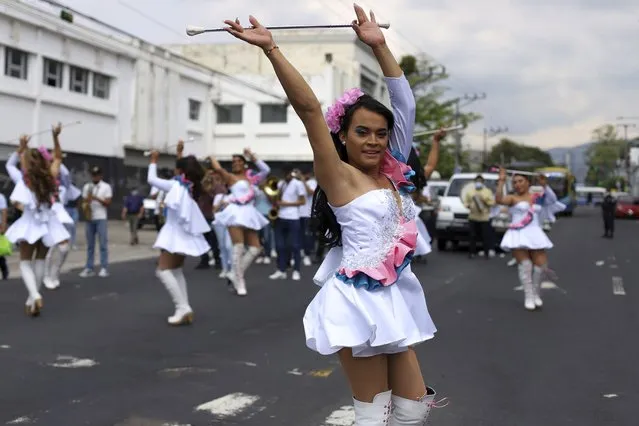 Members of the “Pearls of the East” parade squad perform marking the International Day Against Homophobia, in San Salvador, El Salvador, Monday, May 17, 2021. The parade squad, in which Zashy Zuley del Cid Velásquez participated, started with some 50 people, but crime and forced displacement have shrunk it to 35, said Venus Nolasco, director of the San Miguel LGBTQ collective “Pearls of the East”. The 27-year-old Del Cid was shot dead April 25, sending shockwaves through the city's close-knit LGBTQ community. (Photo by Salvador Melendez/AP Photo)