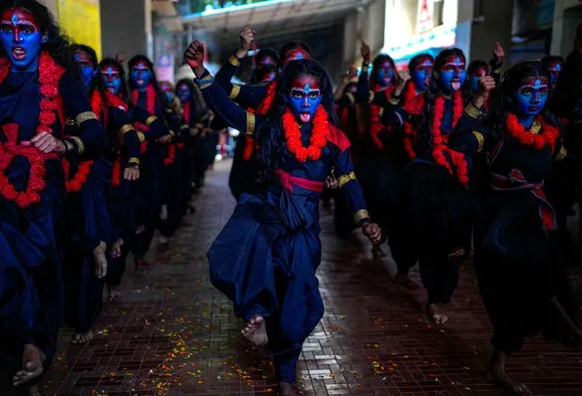 Students at a college with faces painted in blue dance at an event held ahead of Hindu festival Janmashtami in Mumbai, India, Monday, September 4, 2023. Janmashtami, is an annual celebration of the birth of the Hindu deity Krishna. (Photo by Rafiq Maqbool/AP Photo)