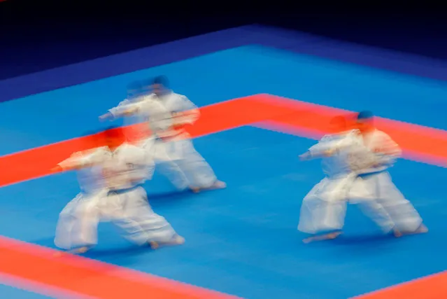 Members of the Kuwait team perform during the men’s team kata at the 2023 Asian Games in Hangzhou, China on October 8, 2023. (Photo by Kim Kyung-Hoon/Reuters)