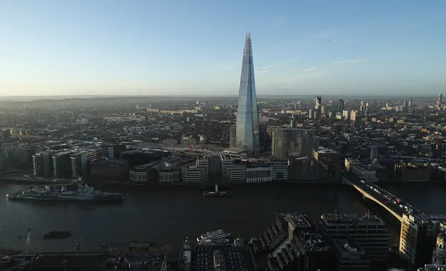 The Shard skyscraper is seen at sunrise from the Sky Garden of 20 Fenchurch Street, nicknamed the Walkie-Talkie building, in the financial district of the City of London, February 19, 2016. (Photo by Eddie Keogh/Reuters)