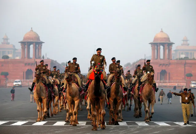 India's Border Security Force (BSF) soldiers ride their camels as they take part in the rehearsal for the Republic Day parade in New Delhi, India, January 16, 2019. (Photo by Amit Dave/Reuters)