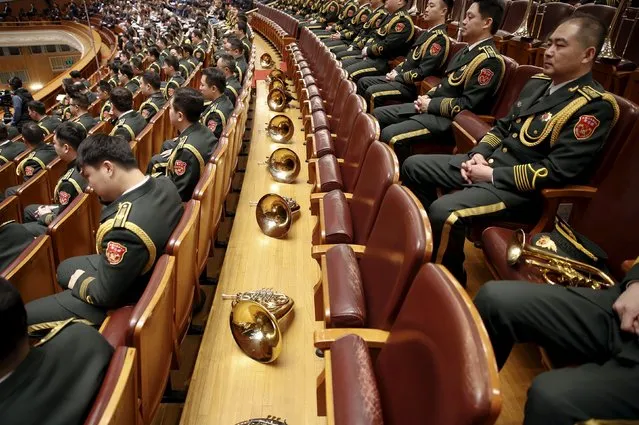 Military band members sit inside the Great Hall of the People during the opening session of the National People's Congress (NPC) in Beijing, China, March 5, 2016. (Photo by Damir Sagolj/Reuters)