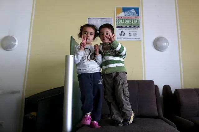 A boy and a girl from Syria pose at the accommodation for migrants “Spree Hotel” in Bautzen, Germany, March 22, 2016. (Photo by Ina Fassbender/Reuters)