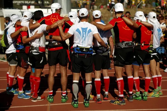 Runners pose for a photo as they wait for the start of the XVIII 101km international competition in Ronda, southern Spain, May 9, 2015. (Photo by Jon Nazca/Reuters)