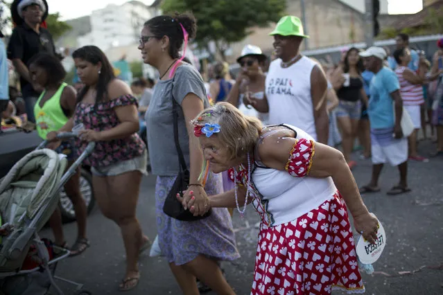 Patients from the Nise da Silveira Mental Health Institute take part on a carnival parade coined, in Portuguese: “Loucura Suburbana”, or Suburban Madness, in the streets of Rio de Janeiro, Brazil, Thursday, February 23, 2017. (Photo by Silvia Izquierdo/AP Photo)