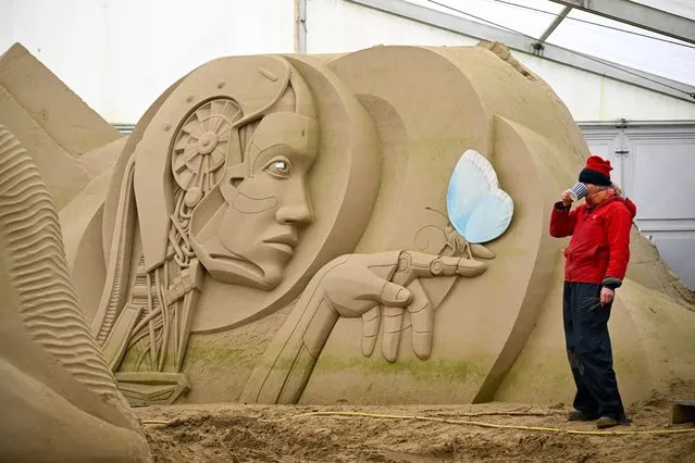 Preparing for the summer season opening this weekend, sculptor at Weymouth's SandWorld Sculpture Park, Lisa Lindqvist takes a break whist working on her sculpture, on March 27, 2024 in Weymouth, United Kingdom. (Photo by Finnbarr Webster/Getty Images)