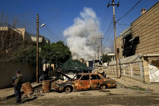 Smoke rises from a car bomb that exploded during a battle with Islamic State militants in Mosul, Iraq, March 6, 2017. (Photo by Thaier Al-Sudani/Reuters)