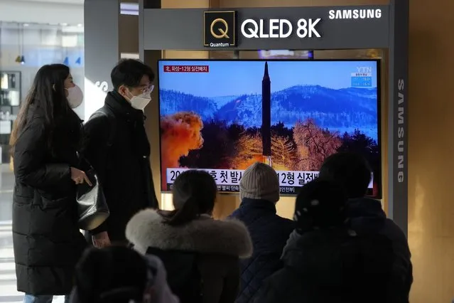 People watch a TV showing an image of North Korea's missile launch during a news program at the Seoul Railway Station in Seoul, South Korea, Monday, January 31, 2022. North Korea confirmed Monday it test-launched an intermediate-range ballistic missile capable of reaching the U.S. territory of Guam, the North's most significant weapon launch in years, as Washington plans to respond to demonstrate it's committed to its allies' security in the region. (Photo by Ahn Young-joon/AP Photo)