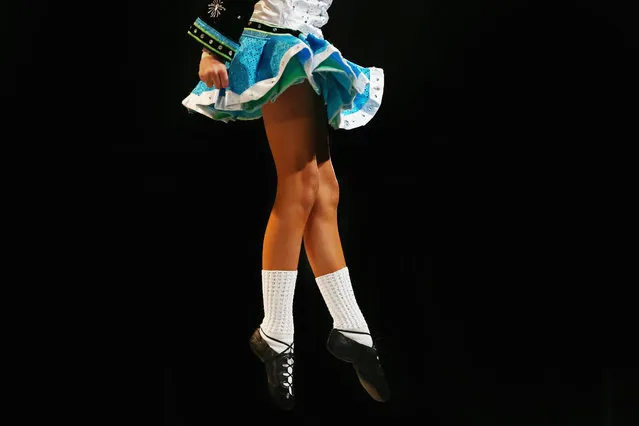 Competitors perform at the World Irish Dance Championship on April 13, 2014 in London, England. The 44th World Irish Dance Championship is currently running at London's Hilton London Metropole hotel, and will host approximately 5,000 dancers competing in solo, Ceili, modern figure choreography and dance drama categories during the week long event. (Photo by Dan Kitwood/Getty Images)