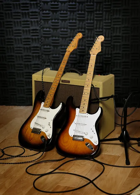 An original 1954 Fender Stratocaster, left, is shown next to a 2014 model at a studio in Scottsdale, Ariz. on Friday, Jan. 10, 2014. Leo Fender developed the instrument in a small workshop in Fullerton, Calif. six decades ago. (Photo by Matt York/AP Photo)