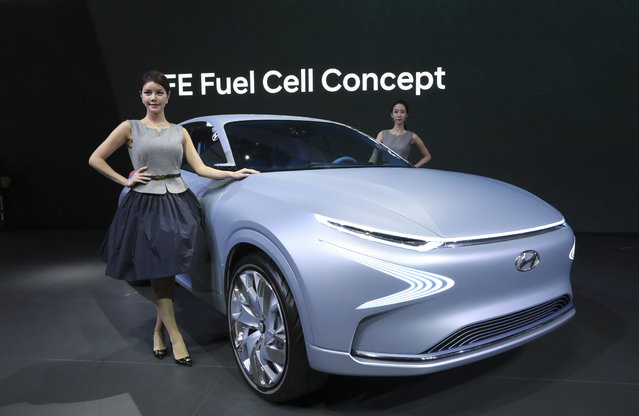 Models pose with Hyundai Motor's FE Fuel Cell Concept car during a media preview of the 2017 Seoul Motor Show in Goyang, South Korea, Thursday, March 30, 2017. (Photo by Lee Jin-man/AP Photo)
