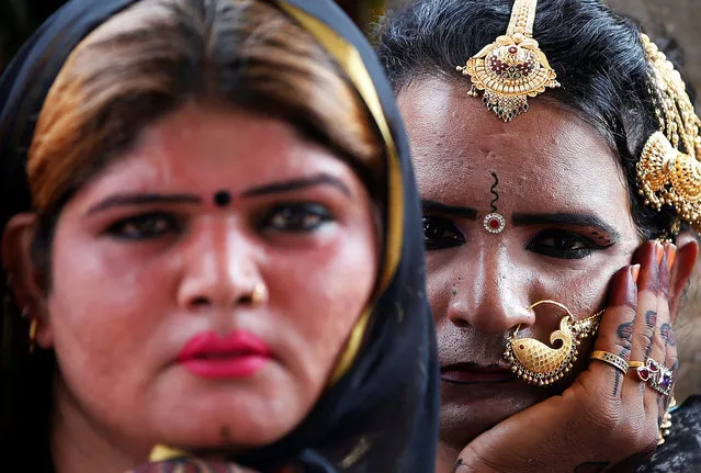 Eunuchs attend a prayer inside a temple as part of a fourteen day long convention honouring eunuchs from across the country, in Gandhinagar March 22, 2017. (Photo by Amit Dave/Reuters)