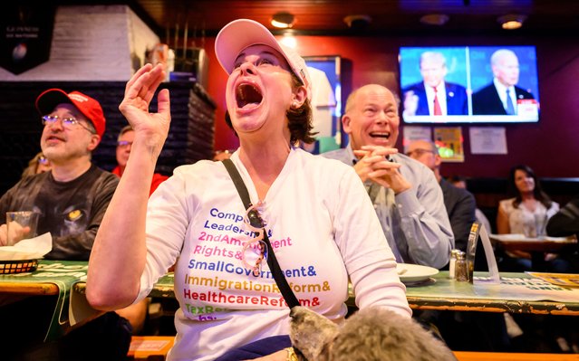 Patrons react during a watch party for the first presidential debate of the 2024 presidential elections between US President Joe Biden and former US President and Republican presidential candidate Donald Trump at a pub in San Francisco, California, on June 27, 2024. The presidential debate is taking place in Atlanta, Georgia. (Photo by Josh Edelson/AFP Photo)