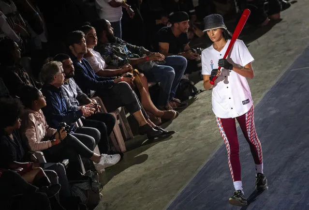 A model wears a creation from “Clandestina”, the first Cuban independent urban fashion brand, during a launch for the 2020 collection called Sports Glories in Havana, Cuba, Friday, November 22, 2019. (Photo by Ramon Espinosa/AP Photo)