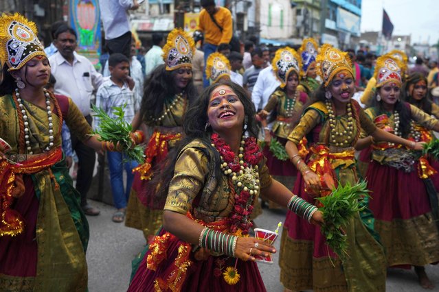 Artists performs during a procession marking “Bonalu” festival in Hyderabad, India, Monday, July 29, 2024. (Photo by Mahesh Kumar A./AP Photo)