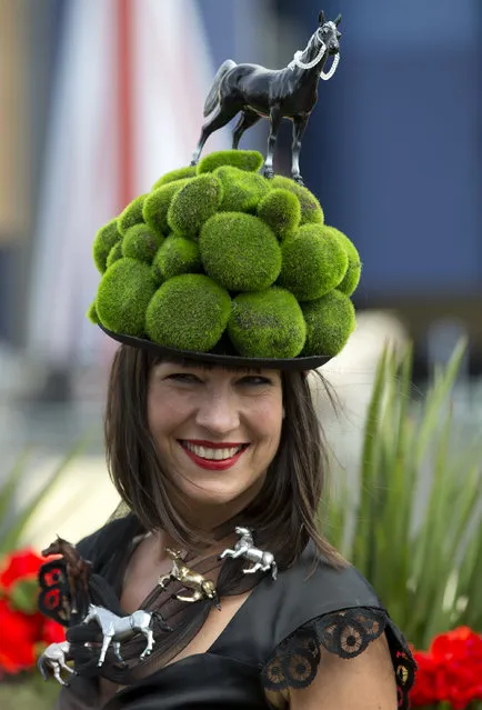 Tiffany Rowe models an ornate hat on the third day of the Royal Ascot horse racing meeting, which is traditionally known as Ladies Day, at Ascot, England,  Thursday, June, 19, 2014. Royal Ascot the annual five day horse race meeting that Britain's Queen Elizabeth II attends every day of the event. (Photo by Alastair Grant/AP Photo)