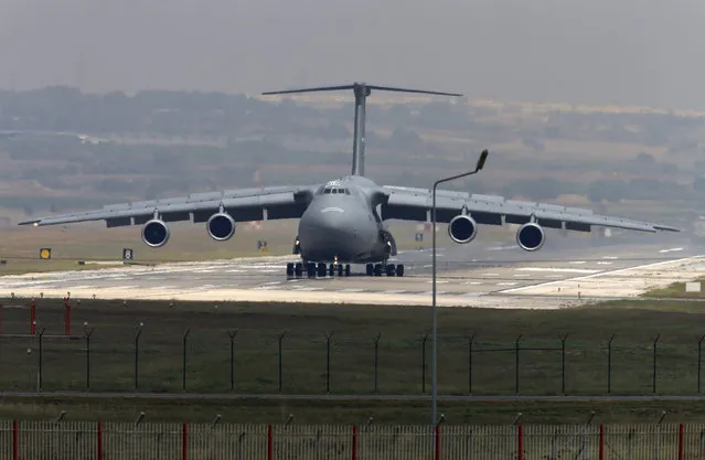 A United States Air Force cargo plane maneuvers on the runway after it landed at the Incirlik Air Base, in the outskirts of the city of Adana, southeastern Turkey, Wednesday, July 29, 2015. After months of reluctance, Turkish warplanes started striking militant targets in Syria last week, and also allowed the U.S. to launch its own strikes from Turkey's strategically located Incirlik Air Base. (Photo by Emrah Gurel/AP Photo)