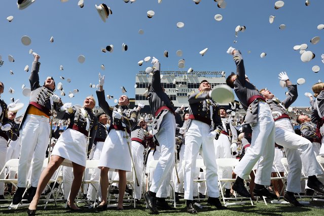 Graduation cadets toss their hats into the air following the conclusion of ceremonies at Michie Stadium at West Point's graduation on May 27, 2023 in West Point, New York. Vice President Kamala Harris will deliver the keynote speech at the ceremony, becoming the first woman to give a commencement address in the military academy's 221-year history. (Photo by Spencer Platt/Getty Images)