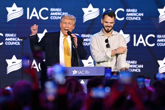 Former US President and Republican presidential candidate Donald Trump (L) speaks alongside Andrei Kozlov (R), an Israeli hostage who was captured by Hamas on October 7, 2023 and freed by the Israel Defense Forces, at the Israeli-American Council (IAC) National Summit in Washington, DC, on September 19, 2024. (Photo by Mandel Ngan/AFP Photo)