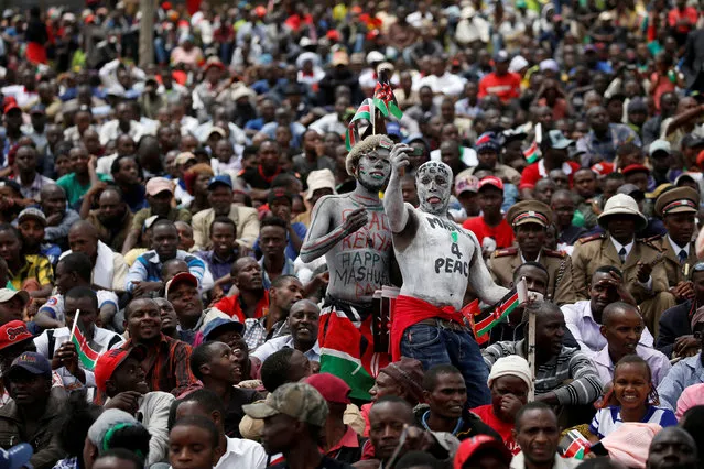 Two men take a selfie during the country's Mashujaa Day (Heroes' Day) celebrations at the Uhuru park in Nairobi, Kenya October 20, 2017. (Photo by Baz Ratner/Reuters)