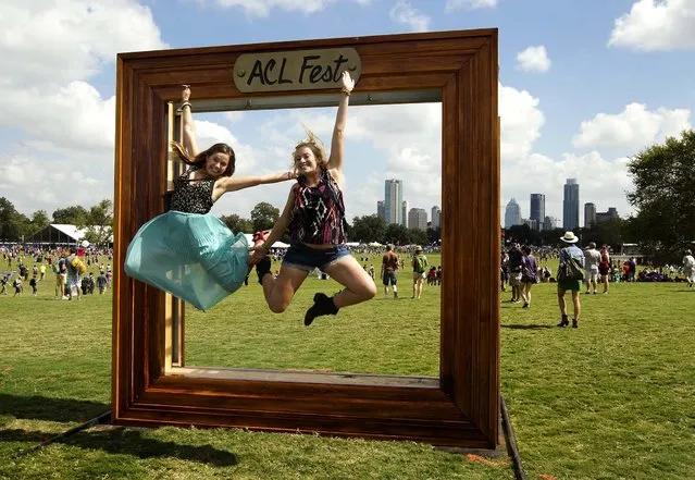 Margo Phillipp of Dallas, and Ashlyn Hobbs of Austin get their picture taken at a picture-perfect spot on top of a hill at Zilker Park at the Austin City Limits Music Festival, on October 12, 2012. (Photo by Jay Janner/American-Statesman)