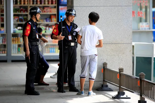 Policemen check a man at Hangzhou Railway Station, which the G20 summit will be held in Hangzhou, Zhejiang province, China, August 3, 2016. (Photo by Aly Song/Reuters)