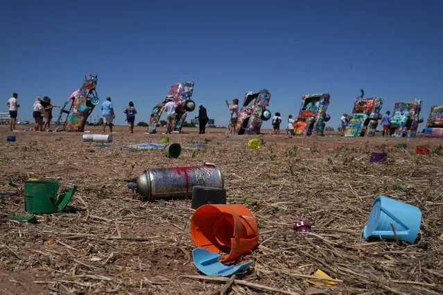 Empty paint canisters at Cadillac Ranch, a public art installation and sculpture in Texas on July 31, 2020. It was created in 1974 by Chip Lord, Hudson Marquez and Doug Michels, who were a part of the art group Ant Farm. The installation consists of 10 Cadillacs buried nose-first in the ground. (Photo by Bryan Smith/ZUMA Wire/Rex Features/Shutterstock)