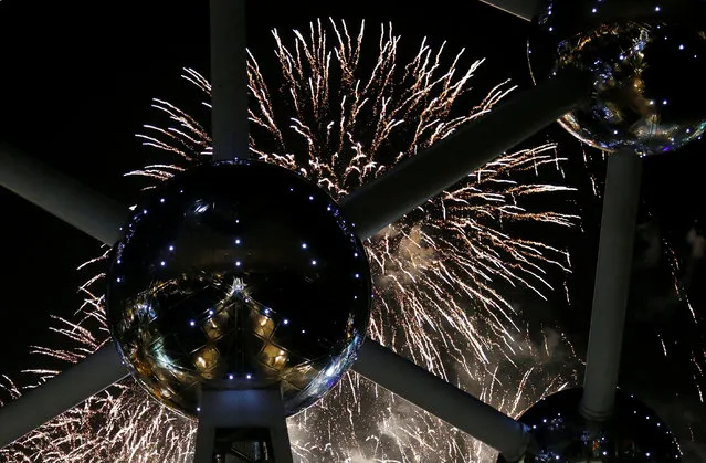 Fireworks light up the Atomium building, a metal structure built in the form of a crystal of iron, in Brussels, Belgium on December 31, 2017. (Photo by Francois Lenoir/Reuters)