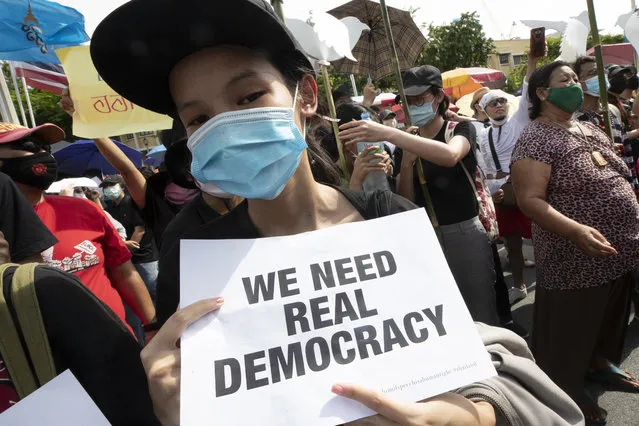 A pro-democracy student holds a poster during a rally in Bangkok, Thailand, Sunday, August 16, 2020. (Photo by Sakchai Lalit/AP Photo)