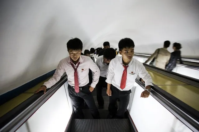 Students use escalators to exit a subway station visited by foreign reporters during a government organised tour in Pyongyang, North Korea, October 9, 2015. (Photo by Damir Sagolj/Reuters)
