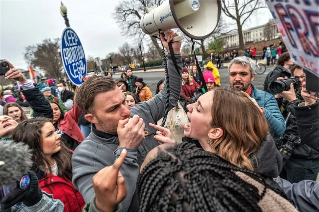 Cherie Sabini, a student at Catholic University, confronts anti-abortion activist AJ Hurley as abortion-rights and anti-abortion activists clash outside of the US Supreme Court in Washington, DC on January 22, 2023. (Photo by Craig Hudson for The Washington Post)