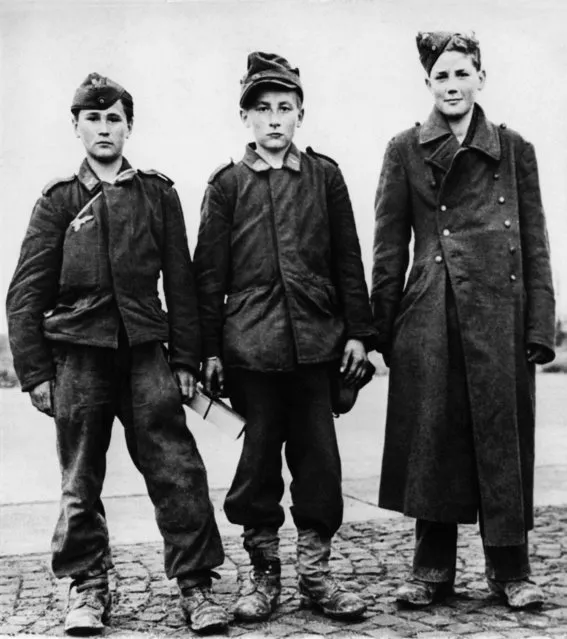 Picture released on April 18, 1945 of three German teenagers, prisoners of the Allies, during the Second World War. (Photo by AFP Photo)