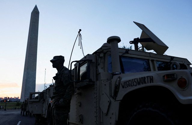 U.S. Army National Guard Humvees park near the Washington Monument on August 13, 2025, after U.S. President Donald Trump announced a federal takeover of the Metropolitan Police Department under the Home Rule Act to assist with crime prevention in the nation's capital. (Photo by Jonathan Ernst/Reuters)