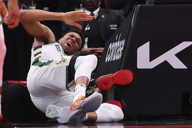 Giannis Antetokounmpo #34 of the Milwaukee Bucks reacts after colliding with the stanchion  during the first half against the Chicago Bulls at United Center on February 16, 2023 in Chicago, Illinois. (Photo by Michael Reaves/Getty Images)