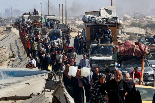 Displaced Palestinians, fleeing northern Gaza due to an Israeli military operation, move southward after Israeli forces ordered residents of Gaza City to evacuate to the south, in the central Gaza Strip on September 15, 2025. (Photo by Mahmoud Issa/Reuters)